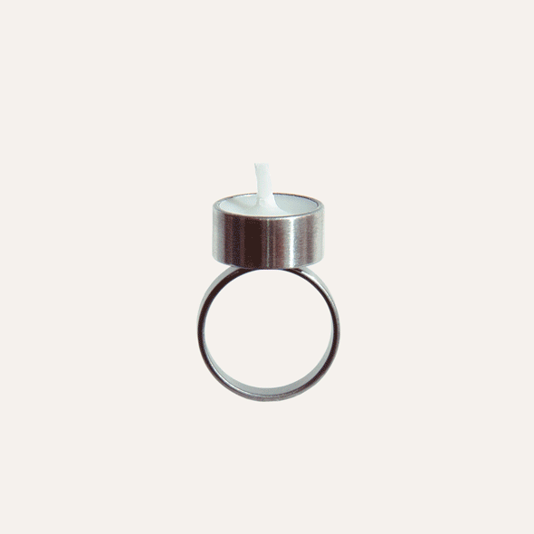 a ring that contains a real tiny candle
